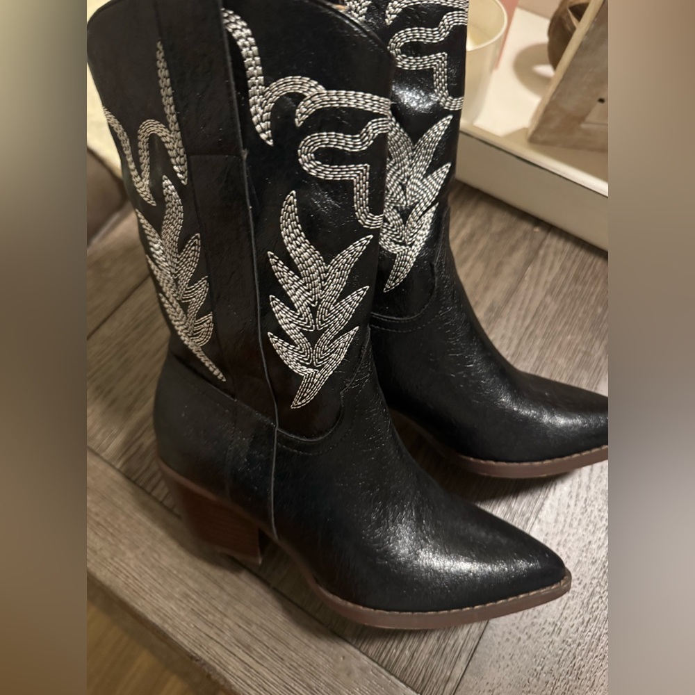 Ladies black leather boots with white stitching